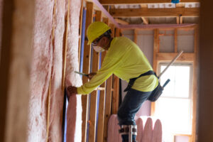 a man wearing a hard hat and safety goggles